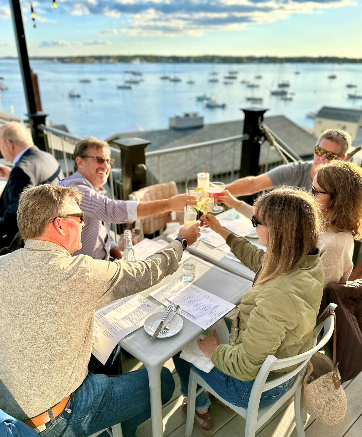 People seating outside Bistro 1828 at Pepperrell Cove Restaurant Kittery Maine